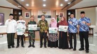 MTQ ASN dan Non ASN Lintas lnstansi, Pj Gubernur Sumut Serahkan Hadiah Ibadah Umrah kepada untuk Para Juara