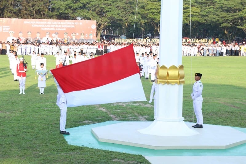 Kirab Khidmat di Rambate Rata Raya: Wakil Bupati Asahan Pimpin Upacara Penurunan Bendera HUT ke-81 RI