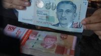 Dolar Singapura menguat ke Rp14.084 pada 19 Oktober 2026. Simak penyebab kenaikan SGD, peluang keuntungan hingga Rp22 juta, dan dampaknya bagi masyarakat Indonesia.